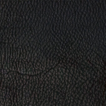 Full-grain leather texture sample, dark black, deeply embossed with raised nodules and ridges, matte finish, egoitaliano rio 1140.